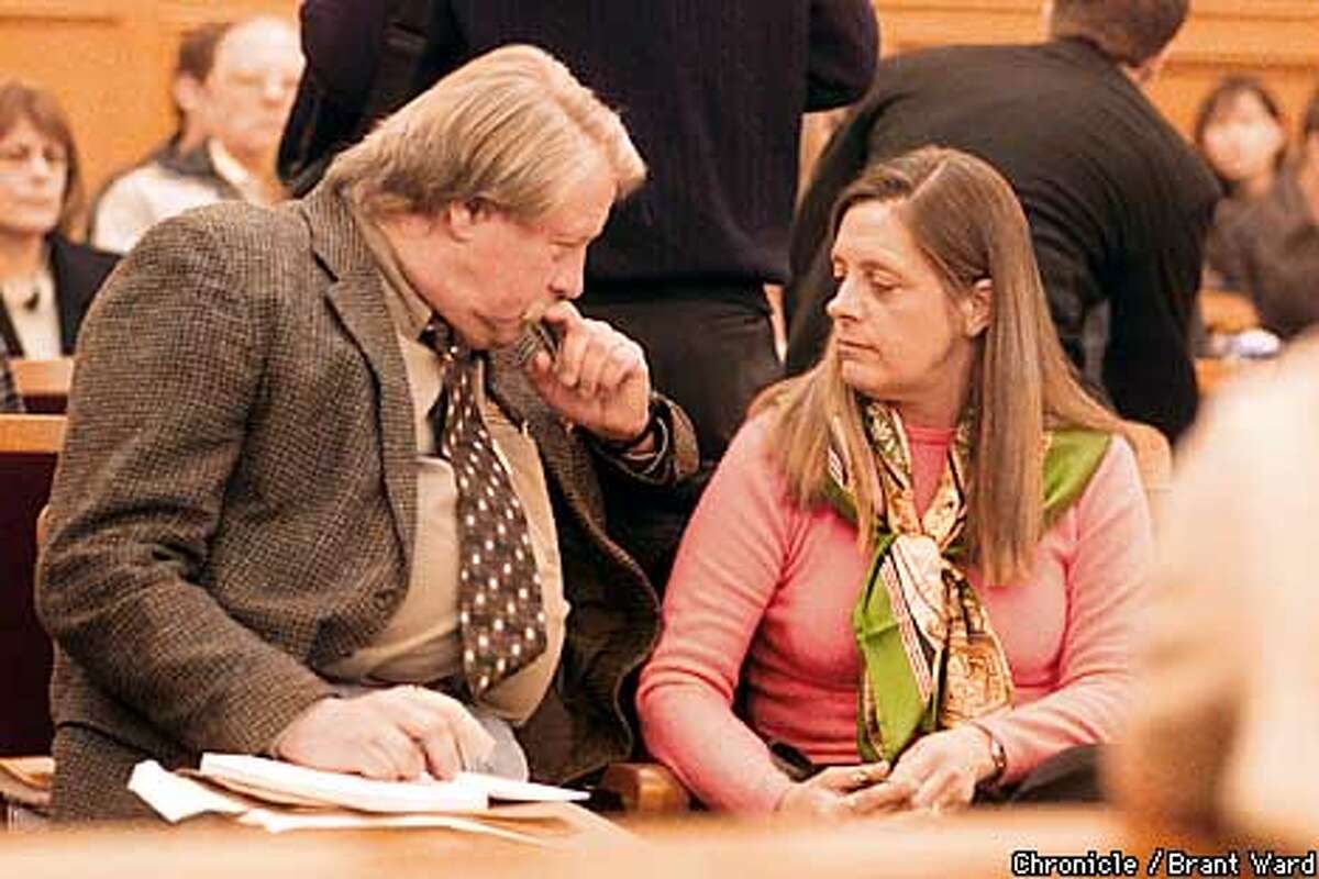 Robert Noel and Marjorie Knoller discuss strategy before he is to testify at the hearing about their dog Hera. The two claim that Hera had nothing to do with the attack and should be spared. By Brant Ward/Chronicle