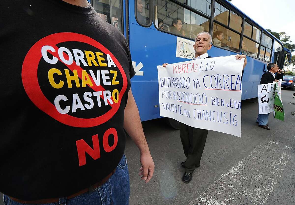 Opponents to Ecuadorean President Rafael Correa shout slogans outside the National Court of Justice (CNJ) in Quito, on January 24, 2012, after the cassation appeal in the trial against El Universo newspaper was suspended. Correa had sued the El Universo newspaper for $80 million in March 2011, alleging "defamatory libel" over a column by former opinion page editor Emilio Palacio accusing the president of crimes against humanity. AFP PHOTO / RODRIGO BUENDIA (Photo credit should read RODRIGO BUENDIA/AFP/Getty Images)