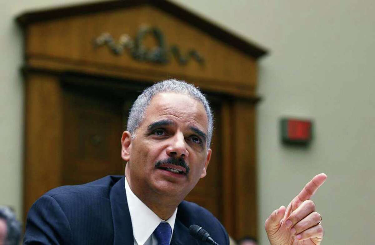 Attorney General Eric Holder testifies during a House Oversight and Government Reform Committee hearing on the Fast and Furious gun-tracking operation.