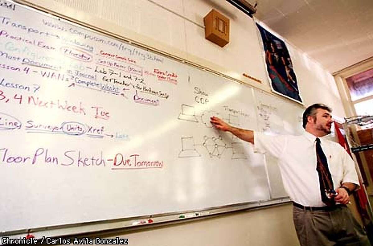 Teacher Cameron Dodge lectures on the latest computer networking technology in his classroom at Sequoia High School on Wednesday, December 9, 1998. His students are participating in Cisco Systems networking academies where they learn the latest in computer networking technologies. (CHRONICLE PHOTO BY CARLOS AVILA GONZALEZ)