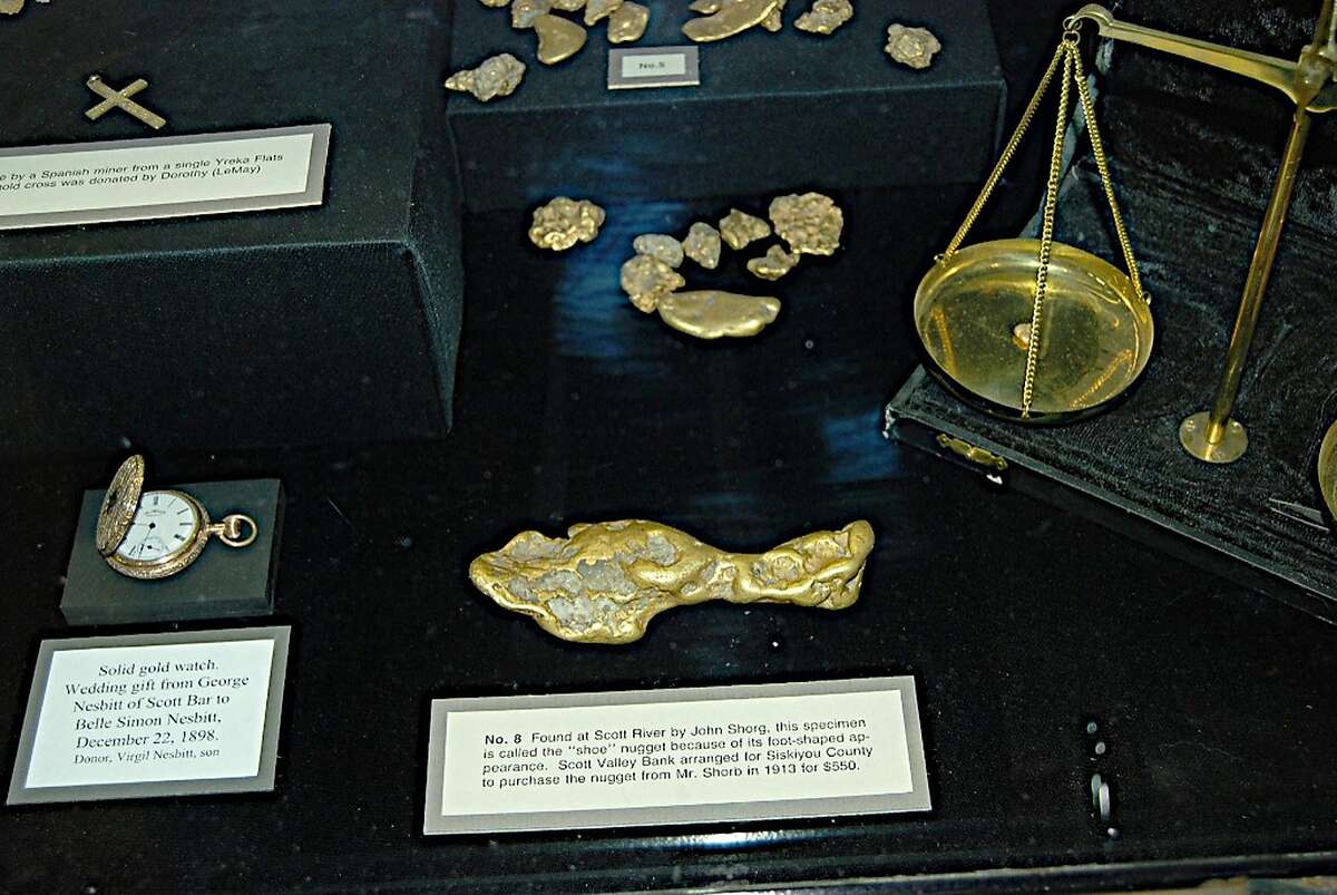 In this Dec. 13, 2006 photo provided by Mel Fechter is a lobby display case of gold nuggets at the Siskiyou County Courthouse in Yreka, Calif. Shown in the foreground is the keystone of the exhibit, a 28-ounce nugget that is known as the "shoe" or "slipper." Thieves broke into the courthouse early Wednesday, Feb. 1, 2012 and stole gold pieces from the display whose total value is estimated at $3 million. County officials and historical experts say the theft of the collection represents an "irreplaceable" loss to the county's cultural identity and past. (AP Photo/Mel Fechter)