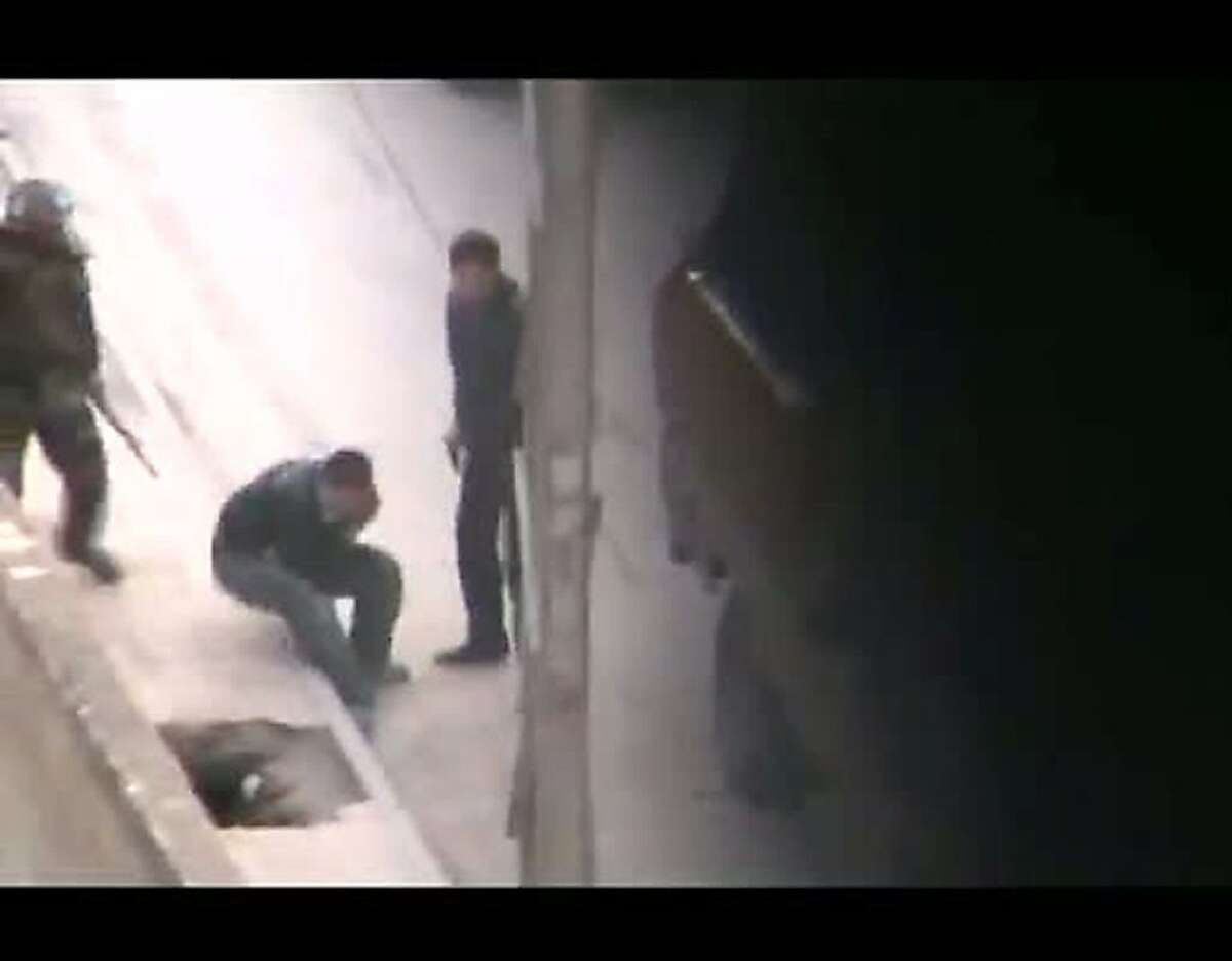 An image grab taken from a video uploaded on YouTube allegedly shows Syrian security forces beating up a man upon his arrest in Mothamiyat al-Sham near Damascus on February 2, 2012.