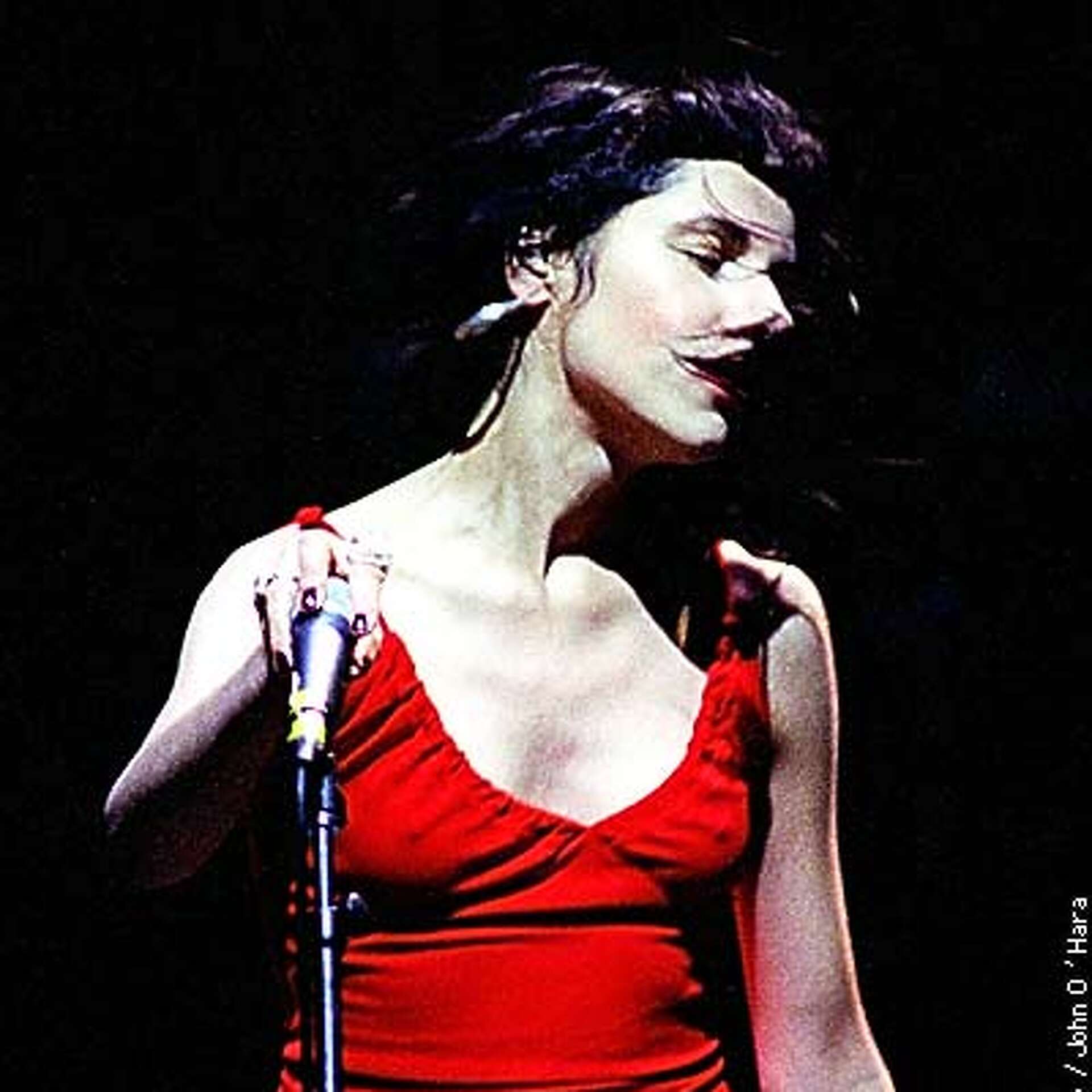 pj harvey red dress P.J. ON ICE / Harvey is note-perfect, but her cool reserve doesn't work onstage