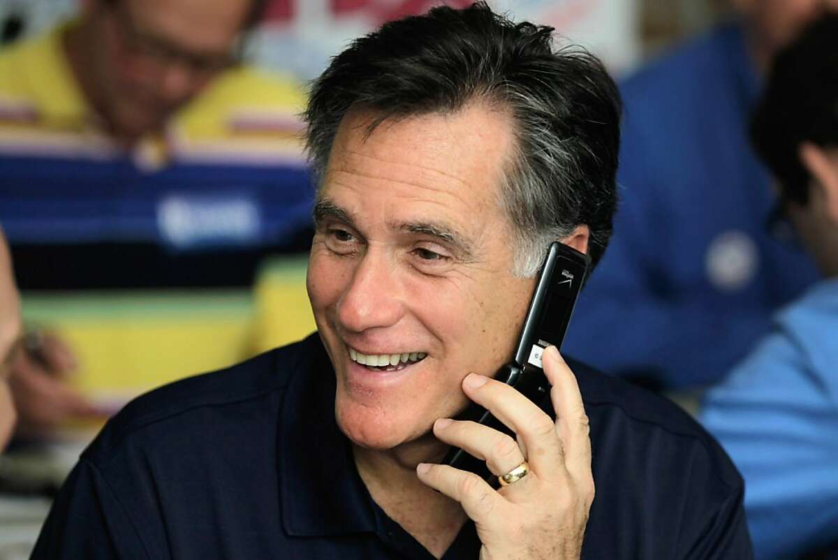 TAMPA, FL - JANUARY 31: Republican presidential candidate and former Massachusetts Gov. Mitt Romney works the phones for votes at his campaign headquarters on January 31, 2012 in Tampa, Florida. Romney has a double-digit lead going into the Florida primary today. (Photo by Joe Raedle/Getty Images)