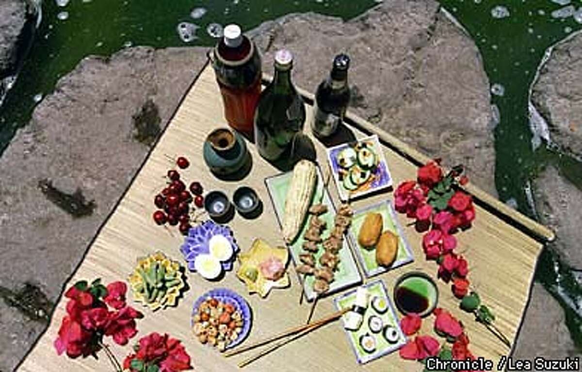 JAPAN, ALFRESCO / On a Japanese picnic, rice balls and sushi share