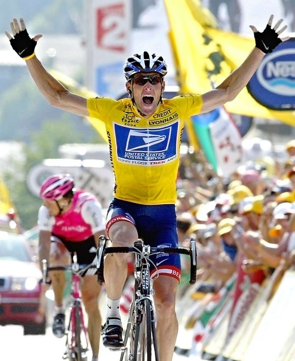 CORRECTS YEAR OF FILE PHOTO TO 2004, NOT, 2005 - FILE - In this July 22, 2004, file photo, overall leader Lance Armstrong reacts as he crosses the finish line to win the 17th stage of the Tour de France cycling race between Bourd-d'Oisans and Le Grand Bornand, French Alps. Federal prosecutors said, Friday, Feb. 3, 2012, they are closing a criminal investigation of Armstrong and will not charge him over allegations the seven-time Tour de France winner used performance-enhancing drugs. (AP Photo/Laurent Rebours, File)