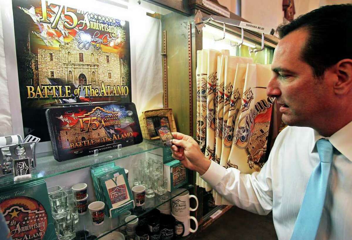 Alamo marketing director Tony Caridi looks through some of the items for sale commemorating the 175th anniversary of the Battle of the Alamo on January 6, 2011. Tom Reel/Staff