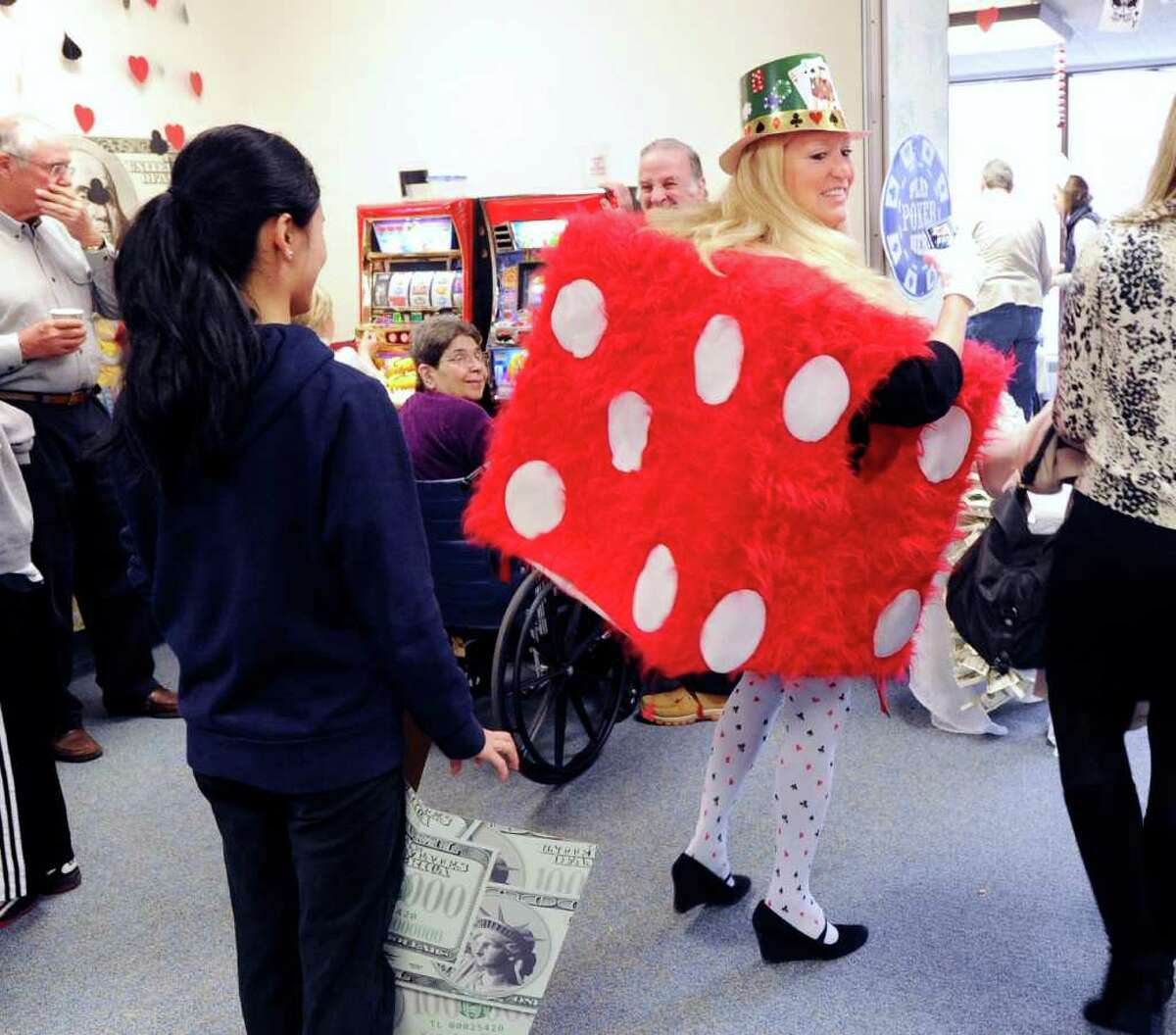 Mary Bruce, Nathanial Witherell's director of activities, dressed as a die during the third annual Casino Party hosted by The Junior League of Greenwich at the Nathaniel Witherell nursing home in Greenwich, Saturday afternoon, Feb. 4, 2012.