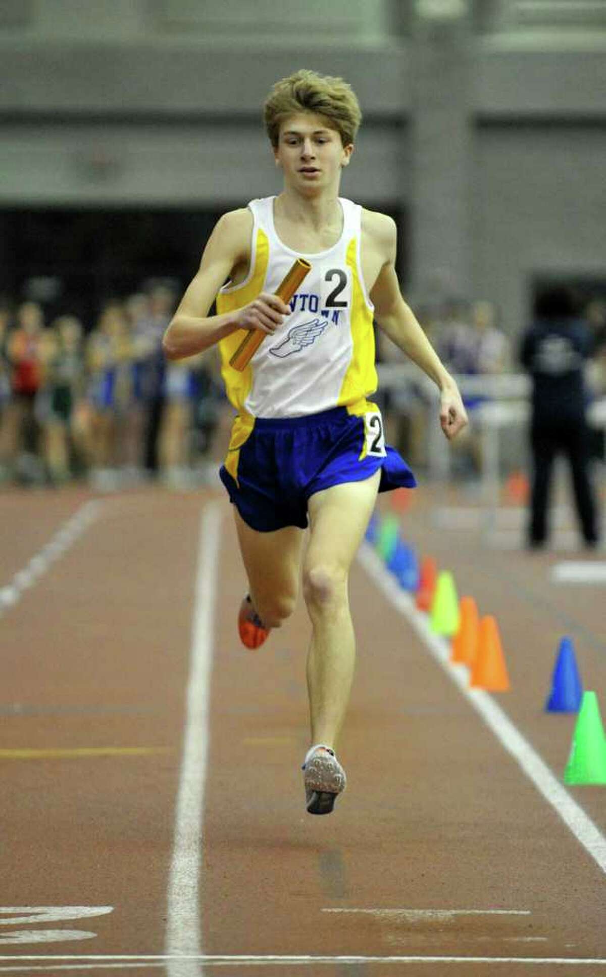 Newtown's Jake Feinstein runs the anchor leg of the 4x800 meter relay during the SWC indoor track and field championships at Hillhouse High School in New Haven on Saturday, Feb. 4, 2012.