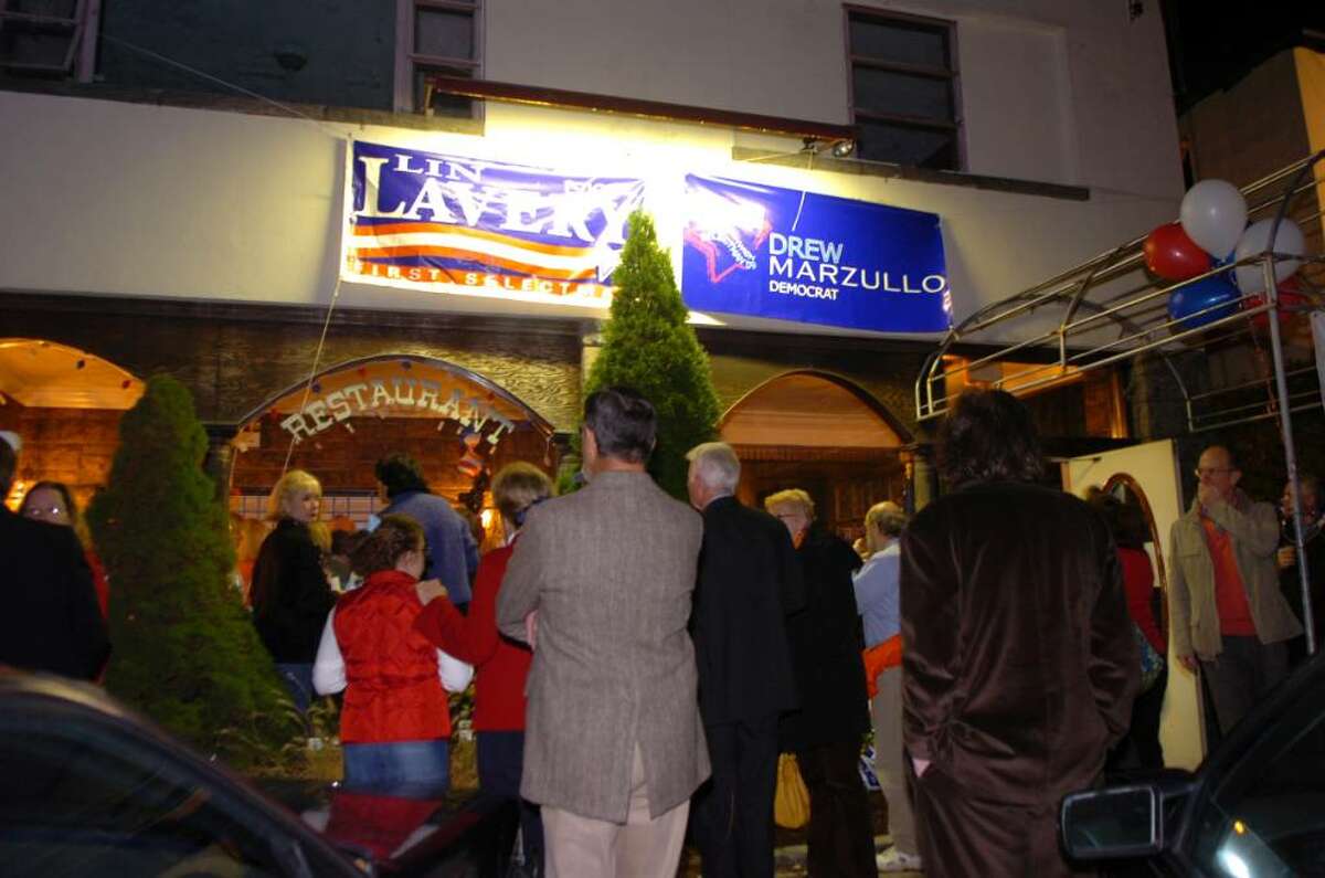 Greenwich, Nov. 3, 2009. People stand in front of the democratic headquarters at the former Horseneck Taver, watching the election numbers coming.