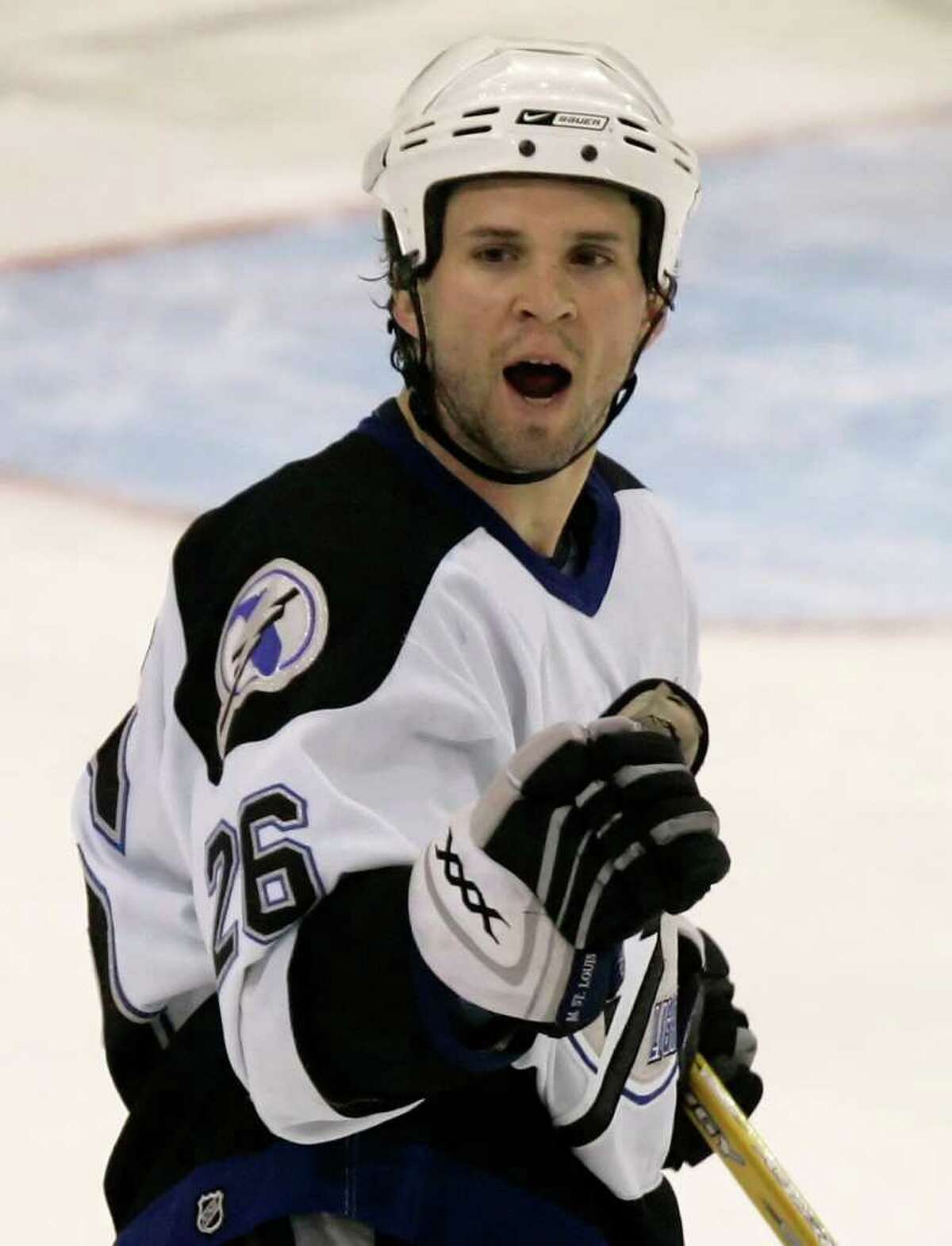 Tampa Bay Lightning's Martin St. Louis (26) celebrates his game-winning shoot out goal against the Pittsburgh Penguins in NHL hockey action in Pittsburgh, Sunday, Jan. 7, 2007. The Lightning beat the Pens 3-2 in a shoot out.(AP Photo/Gene J. Puskar)