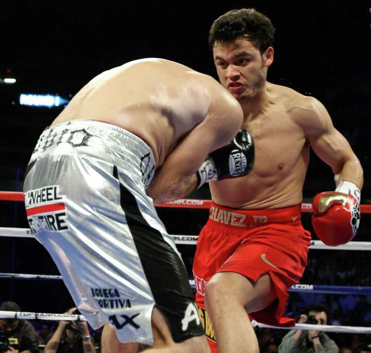 Julio Cesar Chavez, Jr., right, of Mexico, battles it out Saturday Feb. 4, 2012 at the Alamodome in San Antonio Texas against Marco Antonio Rubio, left, of Mexico during their World Middleweight title bout.