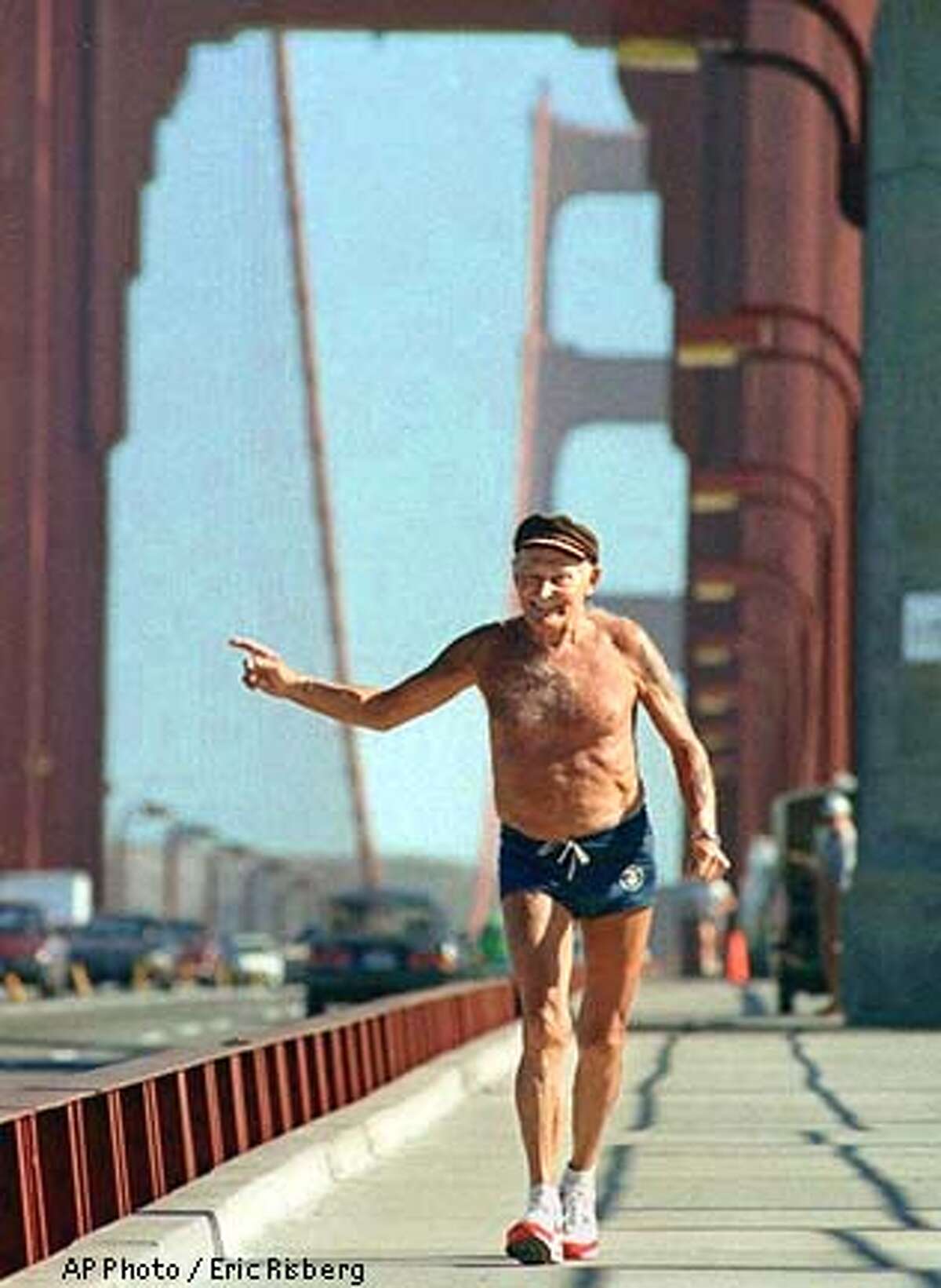 FILE--Octogenarian runner Walt Stack waves at passersby while running across the Golden Gate Bridge in San Francisco in June 1988. Stack, who used to run daily across the bridge to Sausalito and back to San Francisco, died Thursday, Jan. 19, 1995. (AP Photo/Eric Risberg)