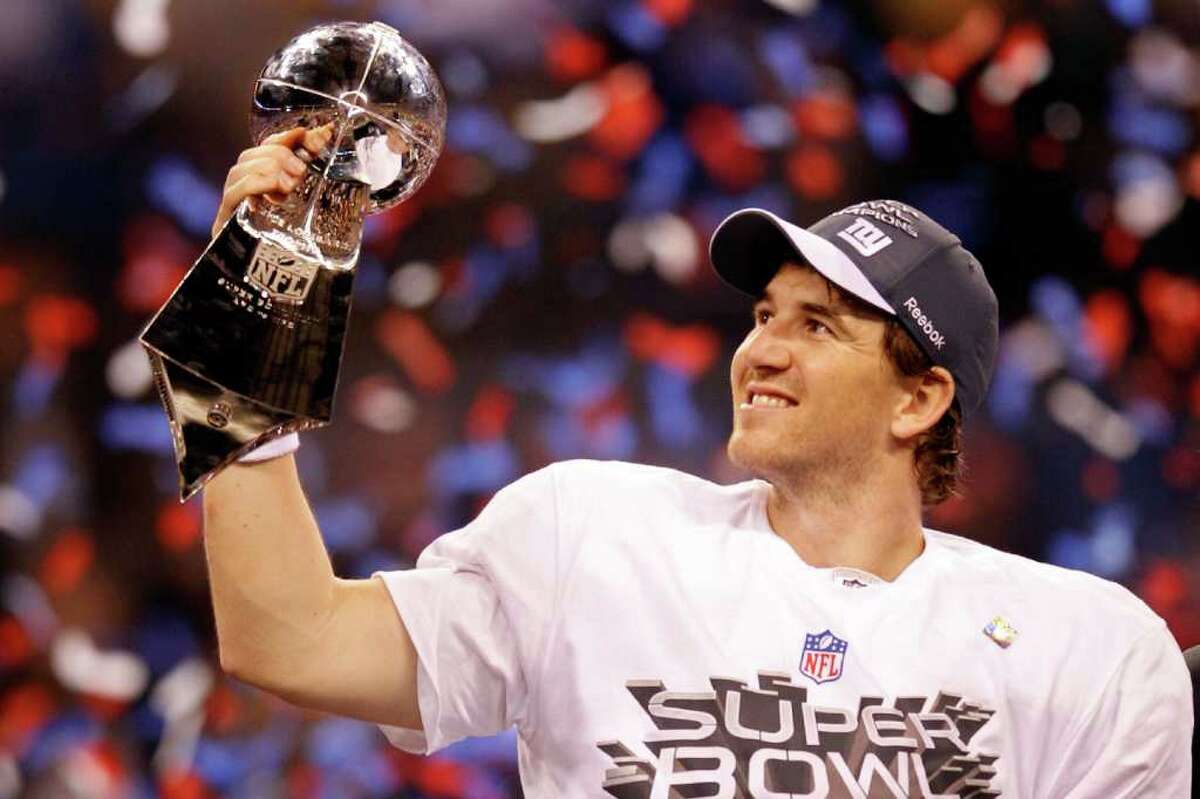 Who is champion. Vince Lombardi Trophy. Quarterback Eli Manning. Pat Manning.