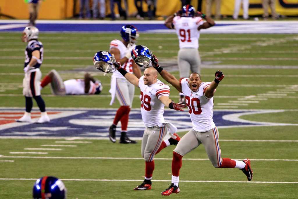 New York Giants - Super Bowl Football New York Giants wide receiver Victor  Cruz (80) holds the Vince Lombardi Trophy during the Super Bowl XLVl  football game against the New England Patriots