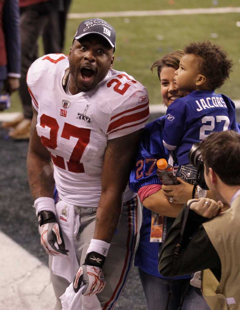 New York Giants - Super Bowl Football New York Giants wide receiver Victor  Cruz (80) holds the Vince Lombardi Trophy during the Super Bowl XLVl  football game against the New England Patriots