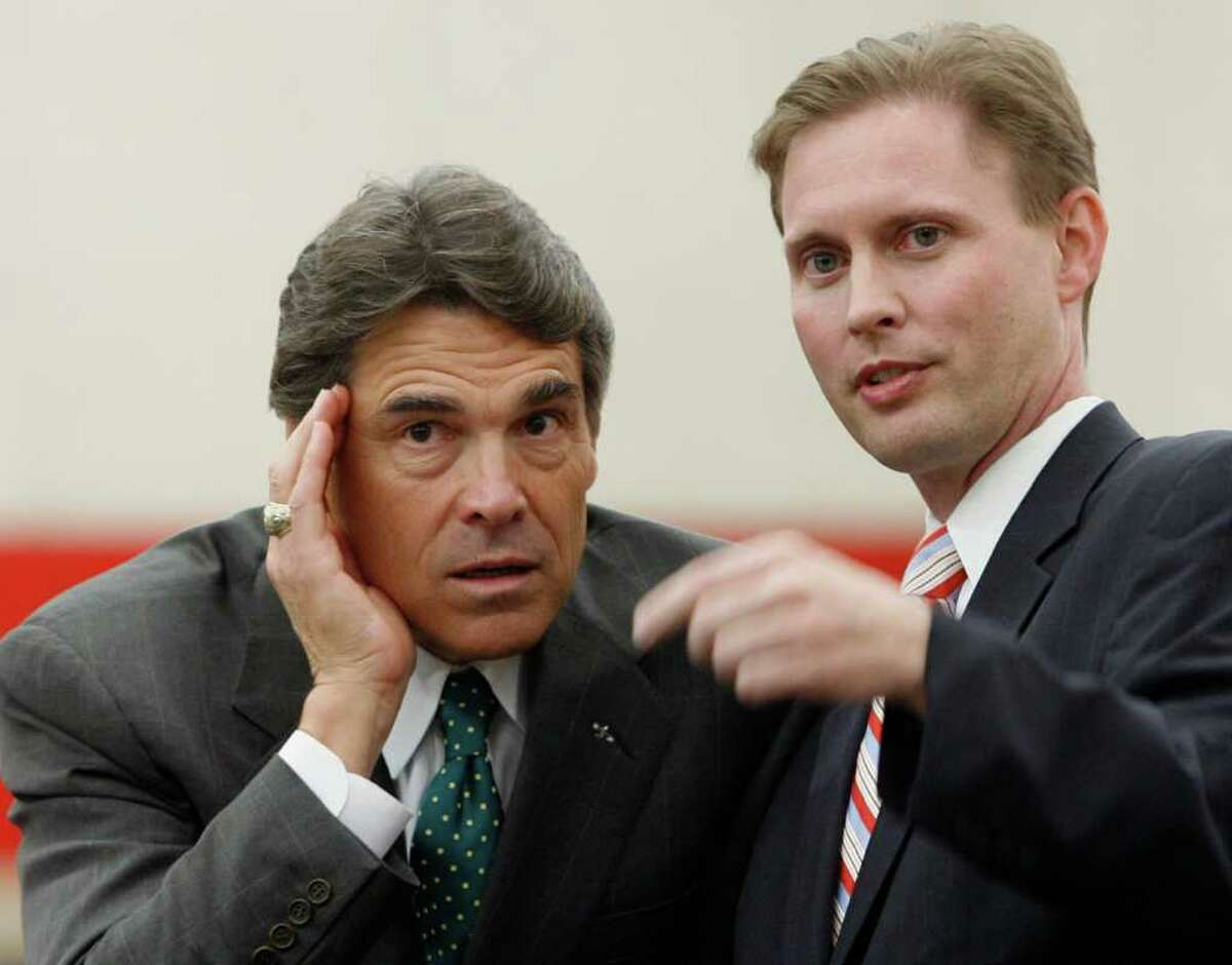 Robert Scott (right, with Texas Gov. Rick Perry) is  Texas Education Agency Commissioner.