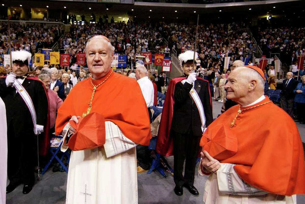 Cardinal Edward Egan, left, and Cardinal Theodore McCarrick, right, enter Harbor Yard Arena during the procession in the 50th anniversary of the Bridgeport Diocese celebration Sunday, Sept. 28, 2003, in Bridgeport Conn. In the recent edition of Connecticut Magazine Egan claims that while bishop in Bridgeport, Conn. he did nothing wrong regarding abuse allegation against priests in the diocese and in fact never had a case of alleged abuse while he was bishop. In the interview Egan also expressed regret for the apology he made regarding the priest scandal here.(AP Photo/Douglas Healey)
