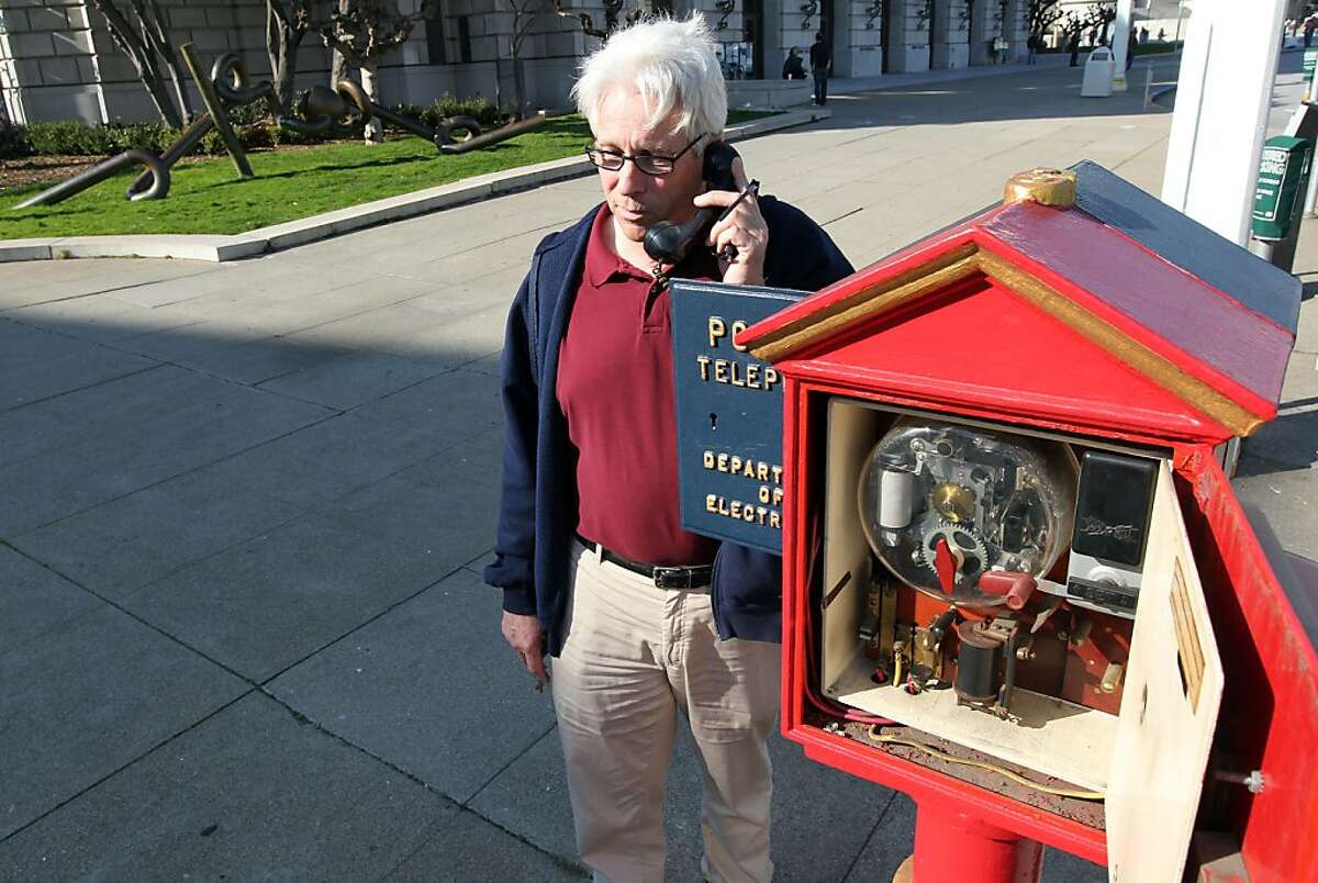 Jack Donohoe from the San Francisco Department of Technology talks to a police dispatcher using the police call box on Van Ness Street. Both Police and fireboxes are dated in the late 1800?•s but the Police box phone is modern and was used when most cell phone communications were down during the Loma Prieta Earthquake of 1989. For over a century, blue and red metal police and fire call boxes have dotted San Francisco's landscape. Friday February 3, 2012.