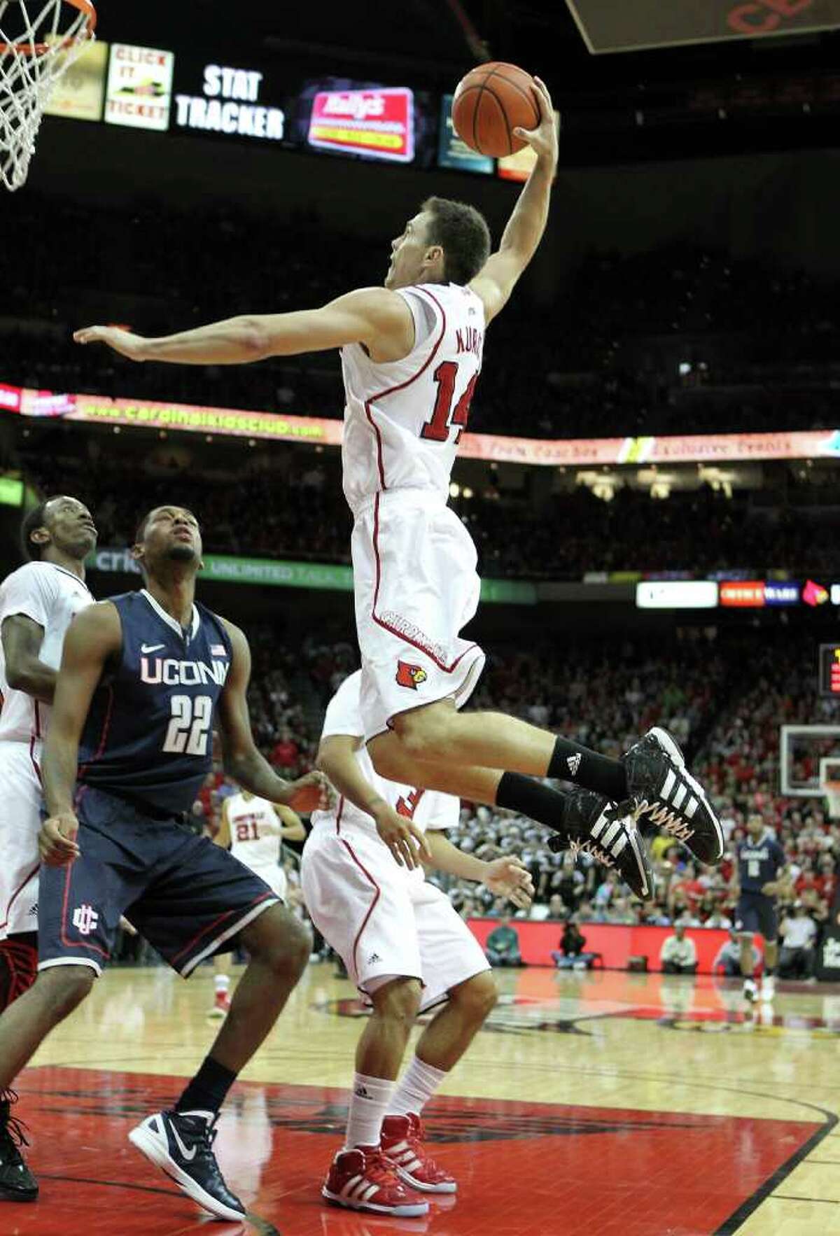 LOUISVILLE, KY - FEBRUARY 06: Kyle Kuric #14 of the Louisville Cardinals shoots the ball during the Big East Conference game against the Connecticut Huskies at KFC YUM! Center on February 6, 2012 in Louisville, Kentucky. (Photo by Andy Lyons/Getty Images)
