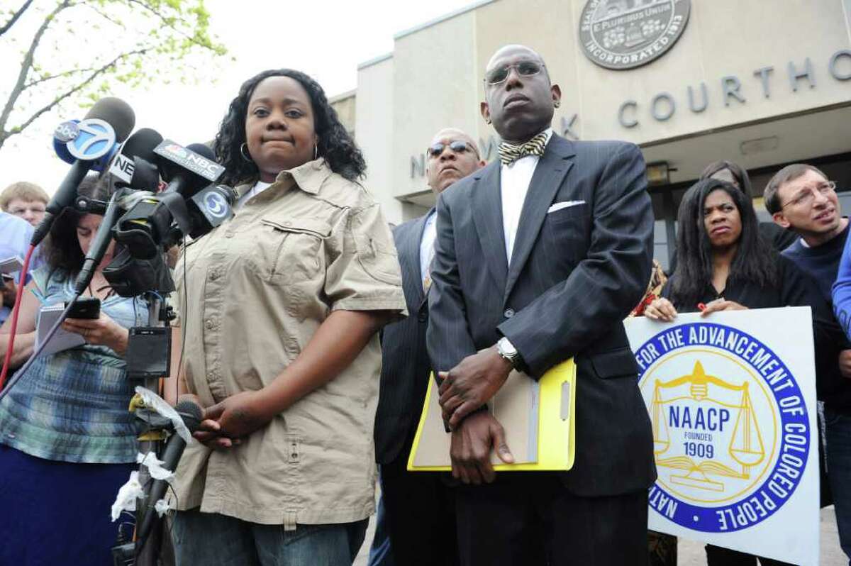 Tanya McDowell, left, conducts a news conference before her arraignment at Norwalk Superior Court on larceny charges in Norwalk, Conn. on Wednesday April 27, 2011. She is accompanied by her attorney Darnell Crosland. McDowell allegedly used a false Norwalk address to enroll her son in Brookside Elementary School. Norwalk police arrested McDowell Friday on drug charges.