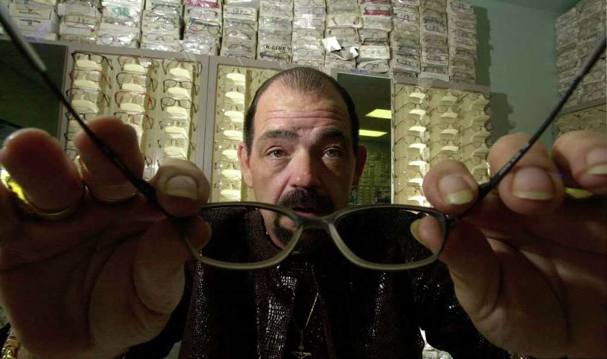 Michael Yuchnitz, owner of the My Econo $39.95 Optical retail glasses chain, poses in his first store on the Southwest Side Thursday, January 3, 2002.