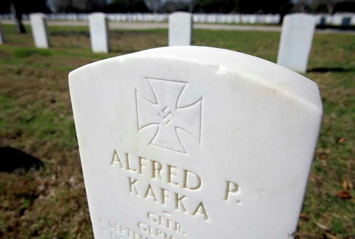 The headstone for World War II German prisoner of war Alfred P. Kafka includes a swastika etched in an Iron Cross and bears the slogan in German, “He died far from his home for the Führer, people and fatherland.”