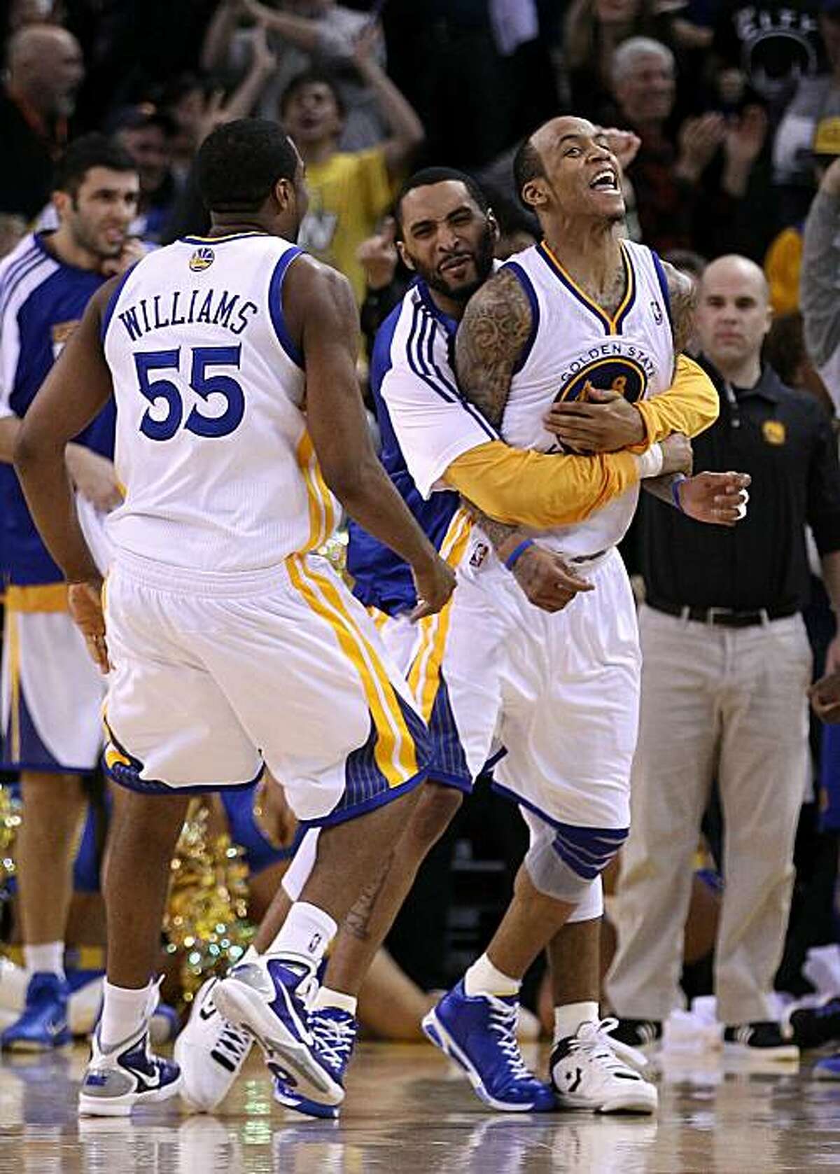 OAKLAND, CA - JANUARY 19: Monta Ellis #8 of the Golden State Warriors is congratulated by teammates after he made the winning shot with 0.6 seconds left in their game againsts the Indiana Pacers at Oracle Arena on January 19, 2011 in Oakland, California.NOTE TO USER: User expressly acknowledges and agrees that, by downloading and or using this photograph, User is consenting to the terms and conditions of the Getty Images License Agreement.
