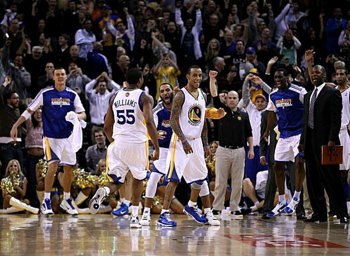 OAKLAND, CA - JANUARY 19: Monta Ellis #8 of the Golden State Warriors is congratulated by teammates after he made the winning shot with 0.6 seconds left in their game againsts the Indiana Pacers at Oracle Arena on January 19, 2011 in Oakland, California.NOTE TO USER: User expressly acknowledges and agrees that, by downloading and or using this photograph, User is consenting to the terms and conditions of the Getty Images License Agreement.