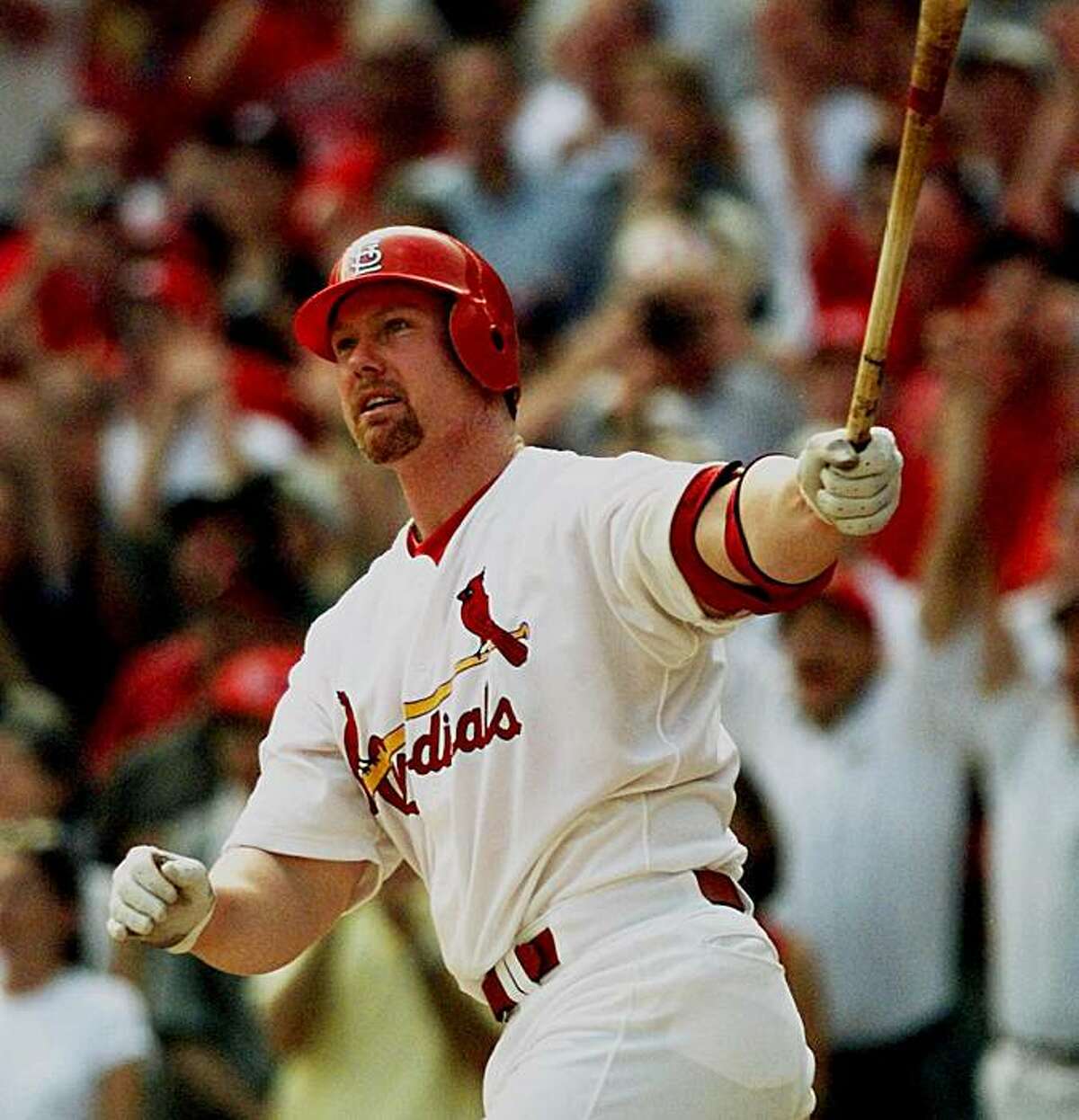 27, 1998 file photo showing St. Louis Cardinals' Mark McGwire watching...