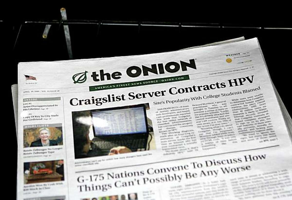 SAN FRANCISCO - MAY 05: A copy of the Onion is seen in a news rack May 5, 2009 in San Francisco, California. Satirical newspaper the Onion is ceasing publication in Los Angeles and San Francisco citing low ad revenue despite an increasing circulation. The Onion, which has a circulation of 60,000 in San Francisco, will continue to publish in other markets like Chicago and New York. (Photo by Justin Sullivan/Getty Images)