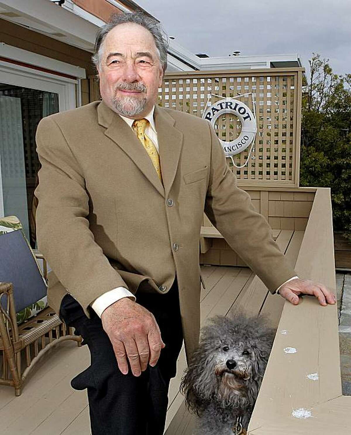 ** FILE ** In this Monday, Dec. 3, 2007 file photo, radio talk show host Michael Savage poses with his dog Teddy in Tiburon, Calif. Radio talk show host Michael Savage, who described 99 percent of children with autism as brats, said Monday July 21, 2008 he was trying to "boldly awaken" parents to his view that many people are being wrongly diagnosed. (AP Photo/John Storey)
