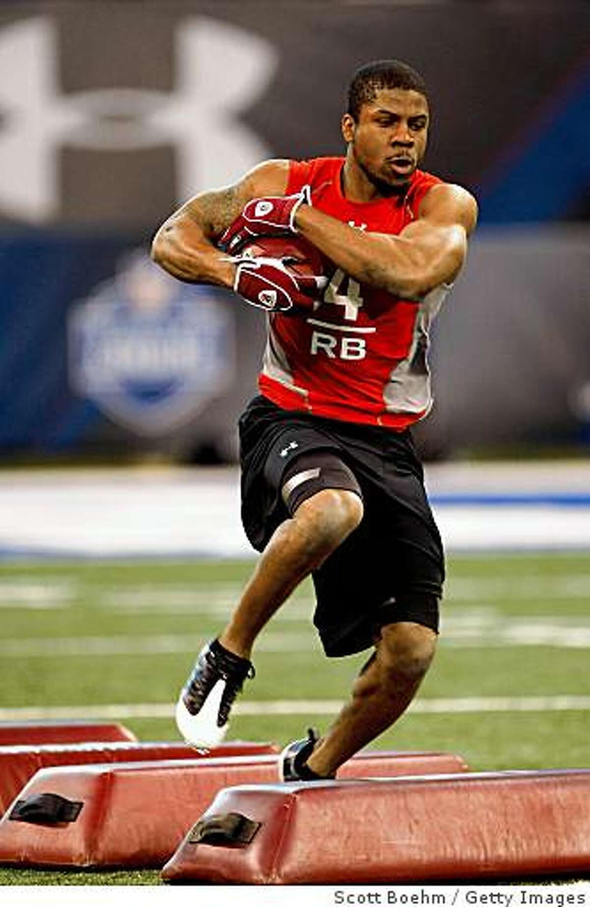 INDIANAPOLIS, IN - FEBRUARY 22: Running back Glen Coffee of Alabama runs with the football during the NFL Scouting Combine presented by Under Armour at Lucas Oil Stadium on February 22, 2009 in Indianapolis, Indiana. (Photo by Scott Boehm/Getty Images)