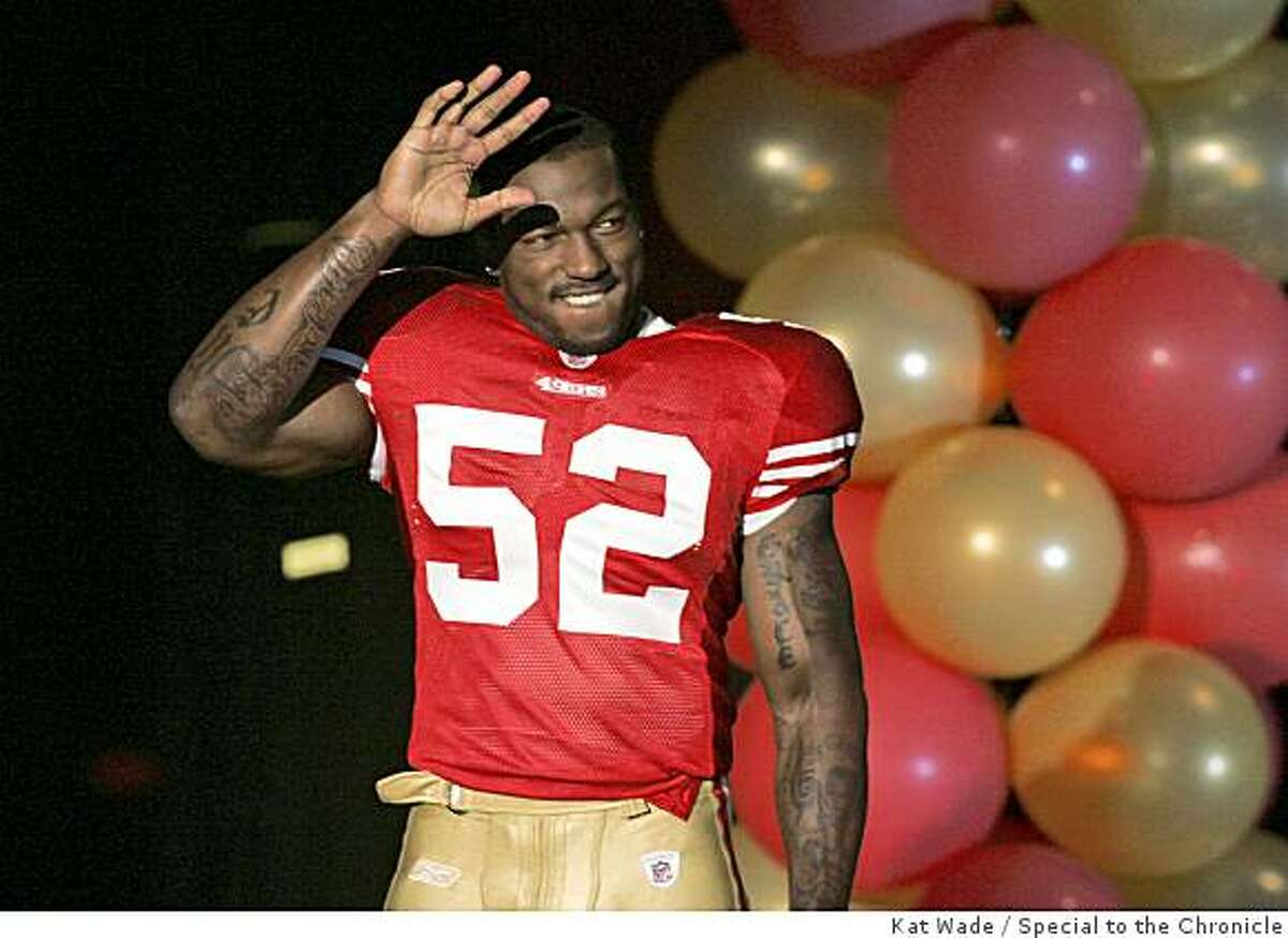 San Francisco 49ers Patrick Willis waves to fans while modeling the 49ers new football uniforms at a NFL Draft party at the Santa Clara Convention Center in San Francisco, Calif. on Saturday, April 25, 2009.