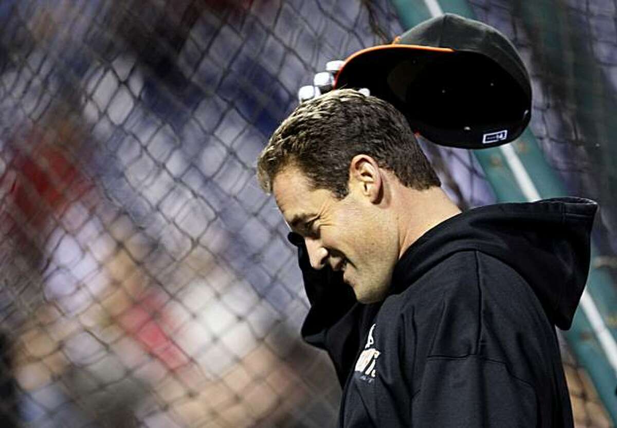 The Giants' Pat Burrell keeps loose outside the batting cage during team warmups prior to Game 6 against the Phillies in the NLCS on Saturday at Citizens Bank Park in Philadelphia.