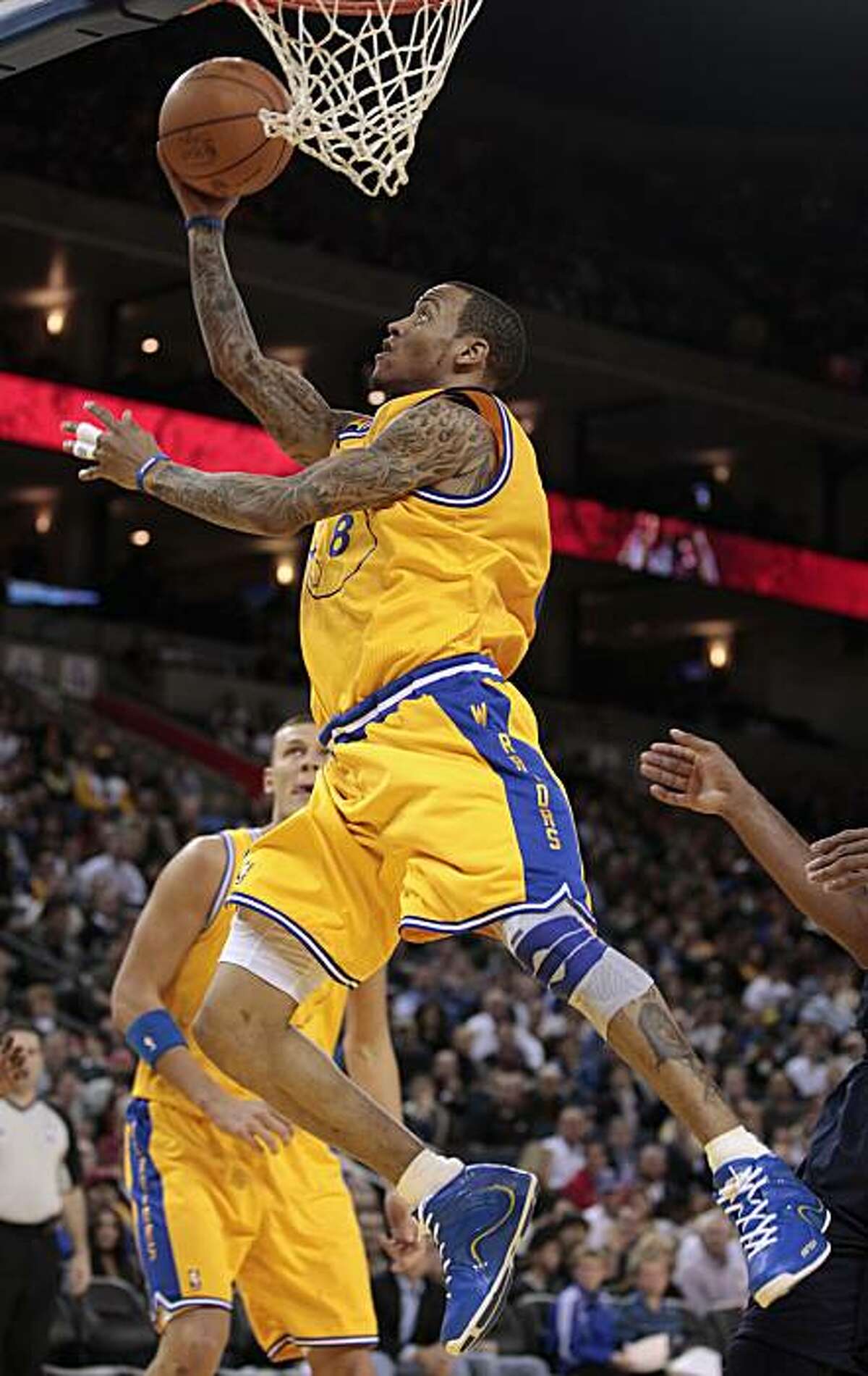Golden State Warriors guard Monta Ellis (8) shoots against the Denver Nuggets in the third quarter of an NBA basketball game in Oakland, Calif., Wednesday, Feb. 9, 2011.