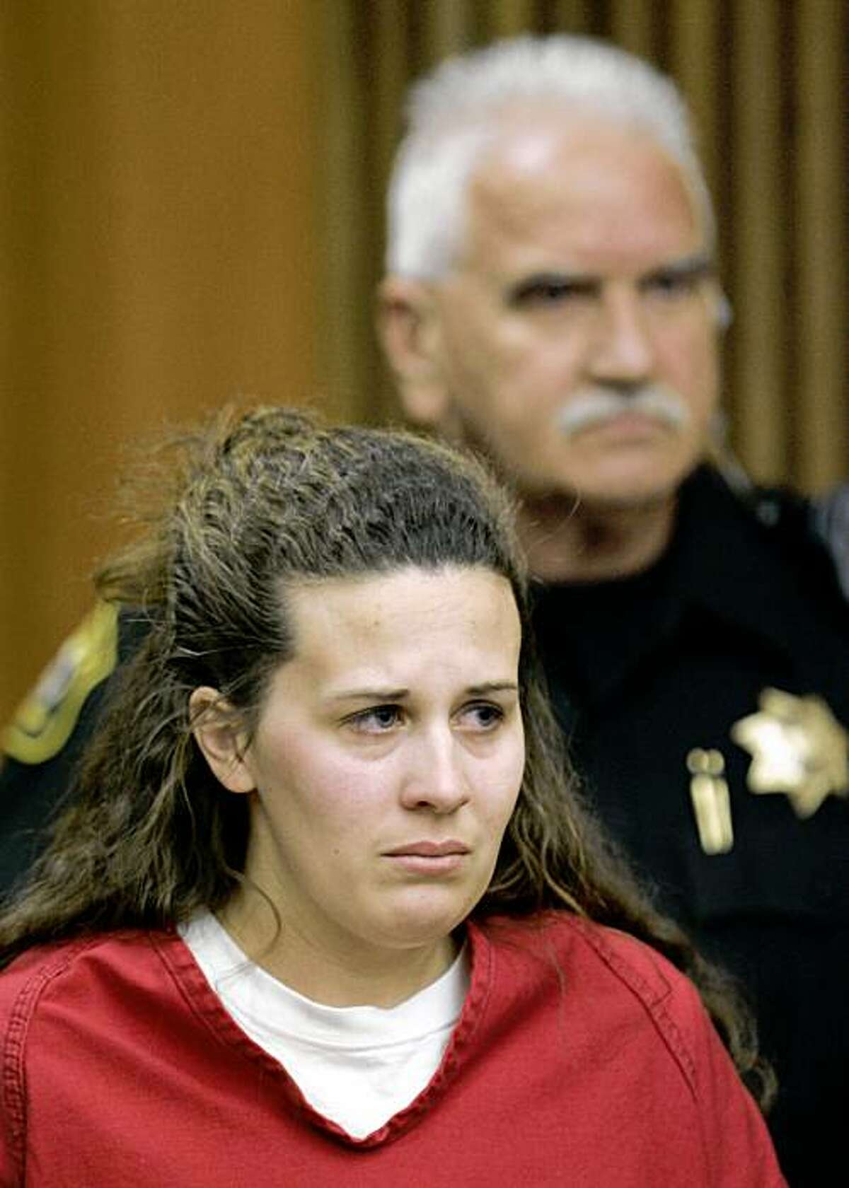 Melissa Huckaby, 28, listens in a Stockton, Calif., courtroom during her arraignment, Tuesday, April 14, 2009. Huckaby was charged with murdering her daughter's friend, 8-year-old Sandra Cantu, in a gruesome crime that has shocked and terrified residents in Tracy, a city of about 78,000 people, 60 miles east of San Francisco. (AP Photo/Paul Sakuma, Pool)