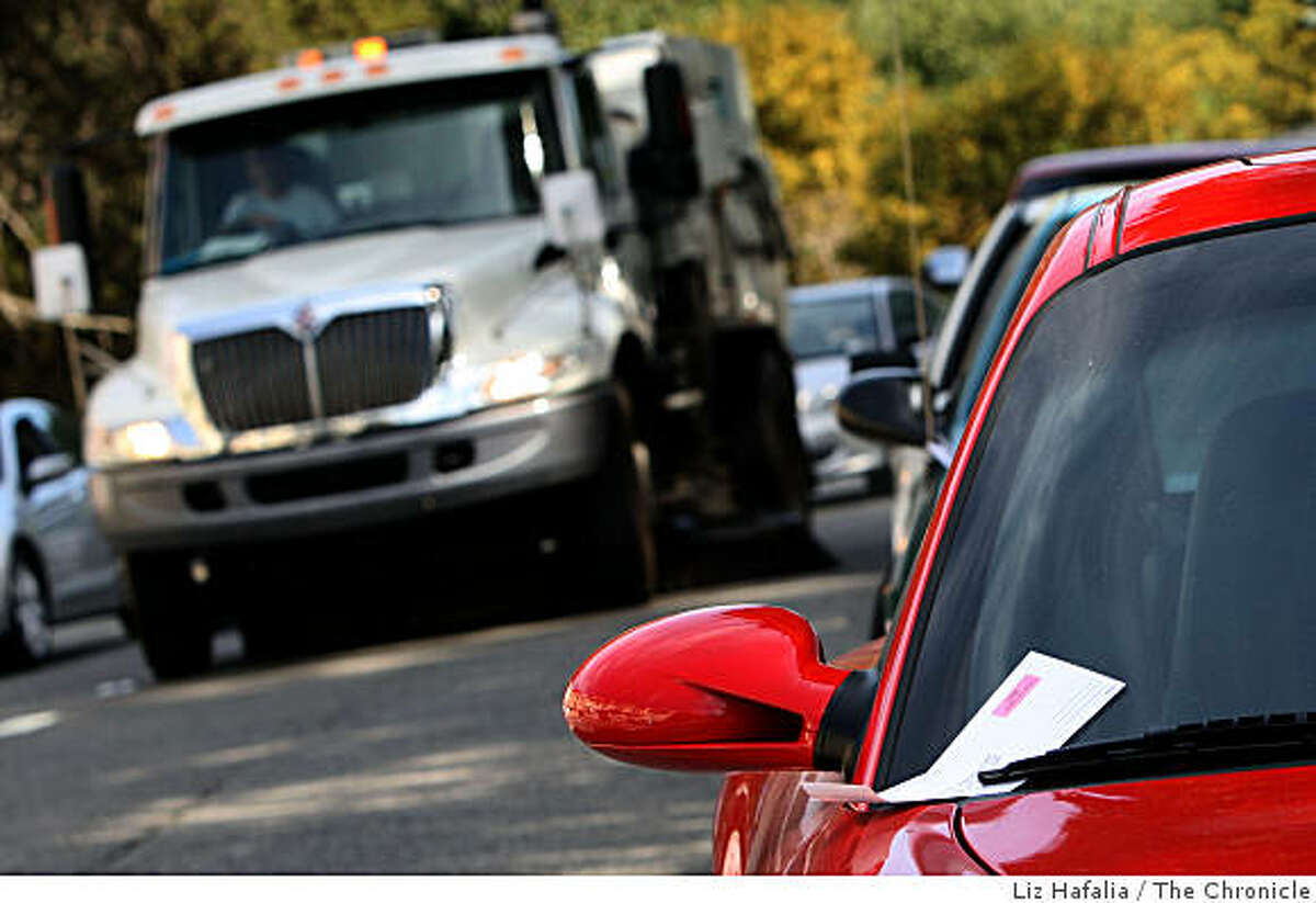 Parking ticket revenue dropped 26 percent last fall when there was a cut in street sweeping last year. Street sweeper passing ticketed parked cars during streetsweeping on 37th Ave. near Lincoln Blvd. in San Francisco, Calif., on Tuesday, April 21, 2009.