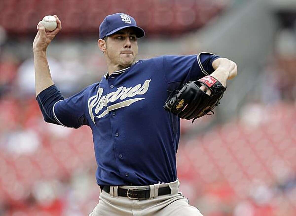 FILE - In this Sept. 19, 2010, file photo, San Diego Padres starting pitcher Jon Garland throws during a baseball game against the St. Louis Cardinals in St. Louis. The Los Angeles Dodgers signed Garland, a free agent, to a $5 million, one-year contract on Friday, Nov. 26, 2010. The right-hander went 14-12 with a 3.47 ERA in 200 innings for the San Diego Padres last year.
