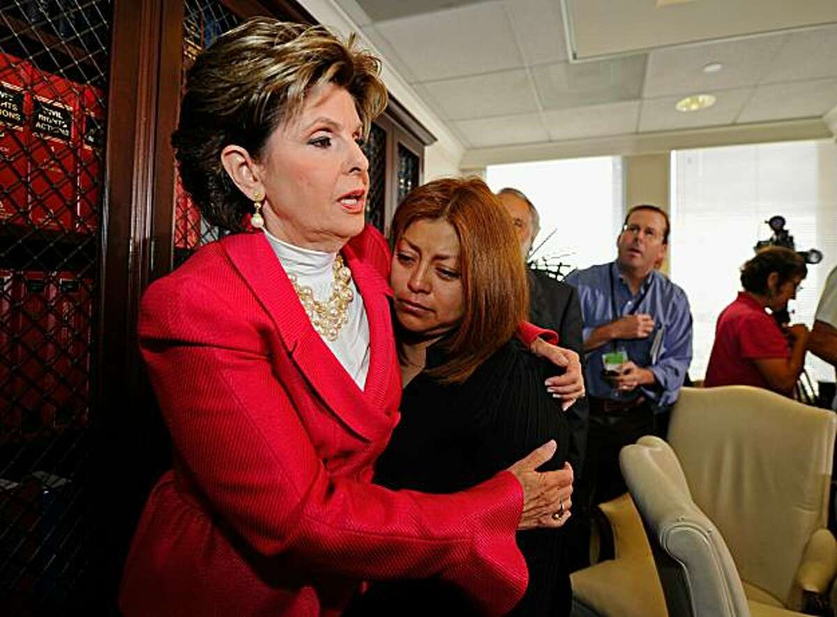 LOS ANGELES, CA - SEPTEMBER 29: Celebrity attorney Gloria Allred (L) consoles her client, California Republican gubernatorial candidate Meg Whitman's former housekeeper Nicky Diaz Santillan as they attend a press conference at Allred's offices on September 29, 2010 in Los Angeles, California. In the news conference Allred claims that Whitman knowingly employed an undocumented worker, Santillan, as her housekeeper for nine years and then fired her a few months after Whitman began her campaign for governor. Allred said she will file a claim for unpaid wages and mileage reimbursement. (Photo by Kevork Djansezian/Getty Images) *** BESTPIX ***