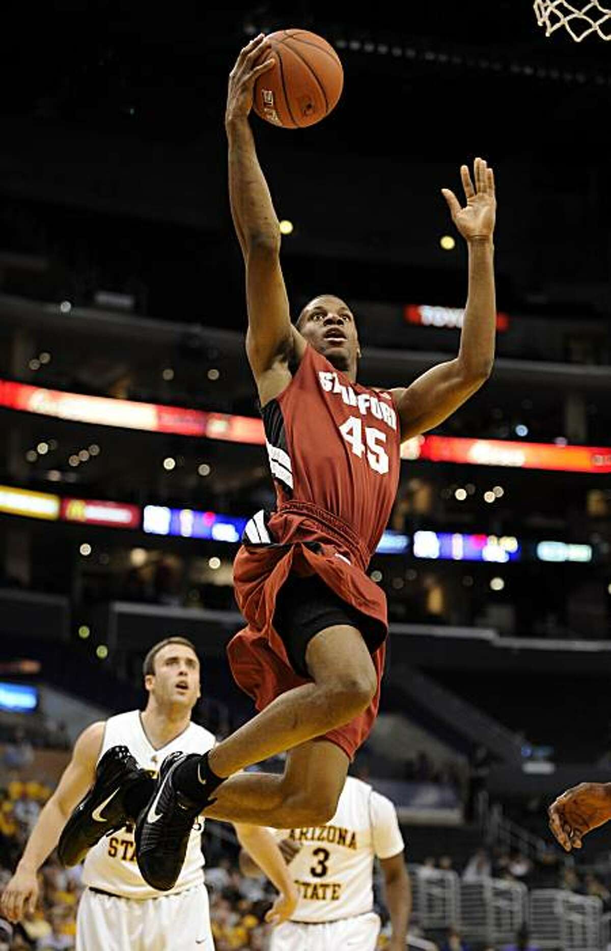 Stanford's Jeremy Green goes up for a shot as Arizona State's Derek Glasser, left, and Ty Abbott look on during the first half of an NCAA college basketball game at the Pac-10 Conference tournament, Thursday, March 11, 2010, in Los Angeles. AP Photo/Mark J. Terrill)