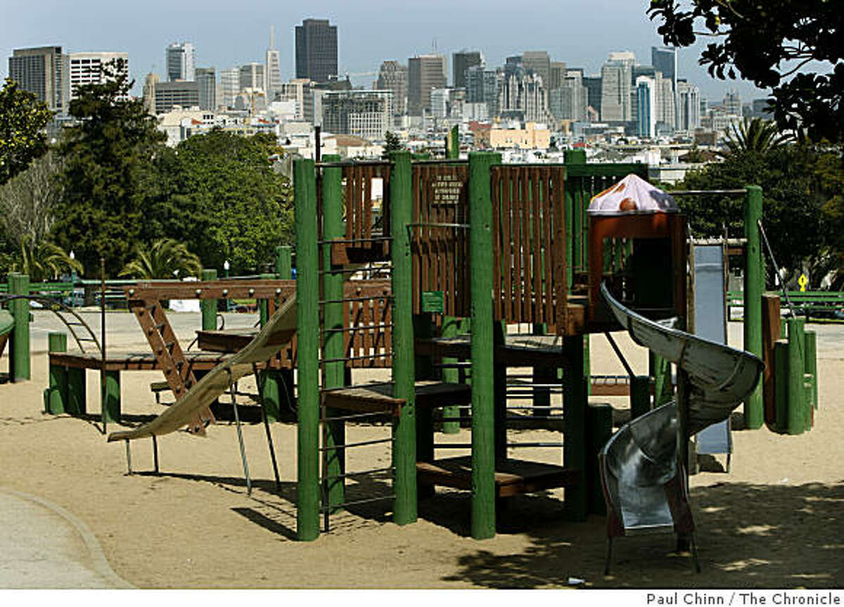 The downtown skyline rises behind the Dolores Park playground in San Francisco, Calif., on Tuesday, March 31, 2009.