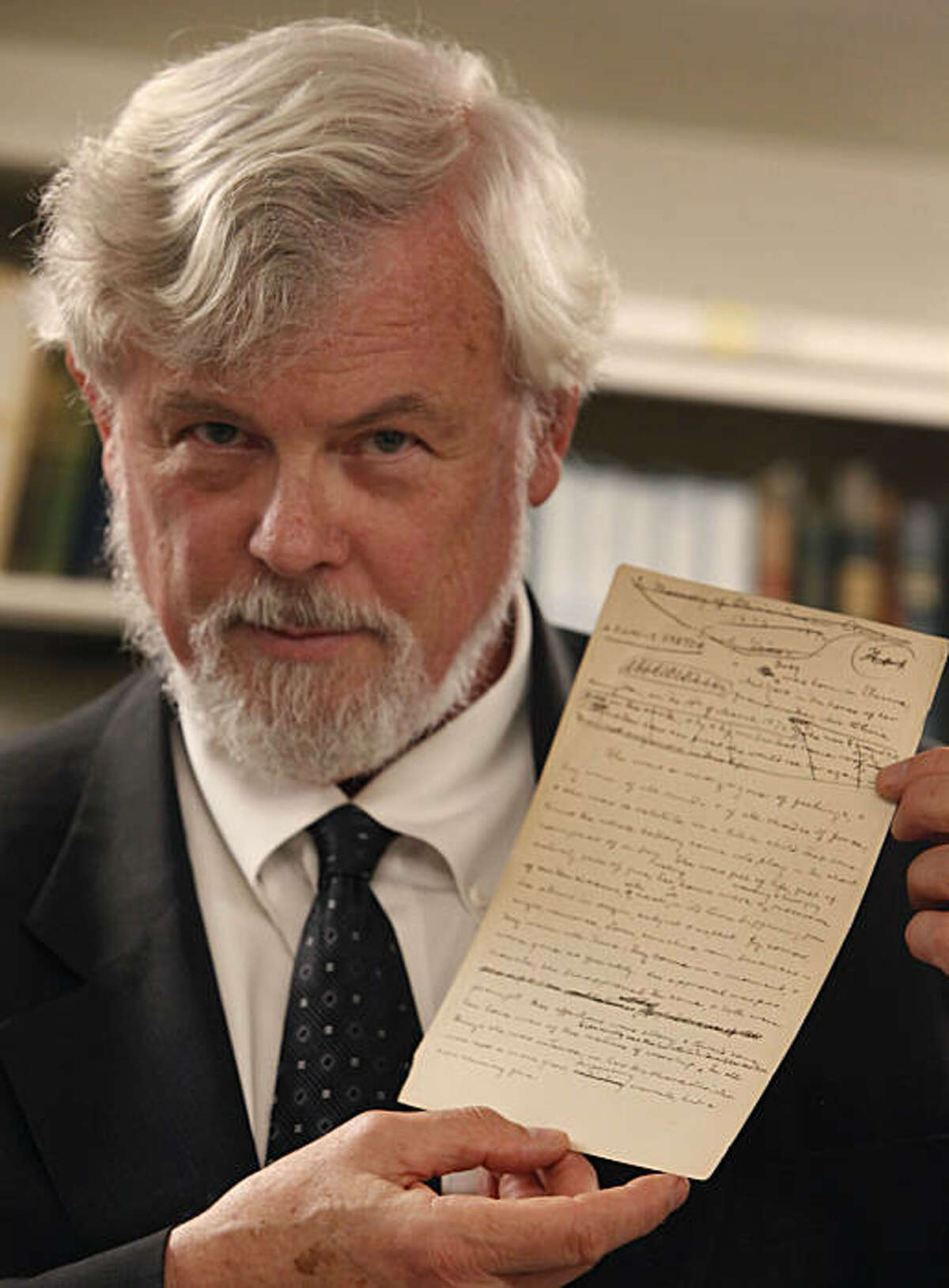 Robert Hirst, general editor Mark Twain Project, holds the first page of "A Family Sketch", a recent acquisition for UC Berkeley, in the Mark Twain Papers vault at the Bancroft Library at UC Berkeley on Friday, November 5, 2010 in Berkeley, Calif.