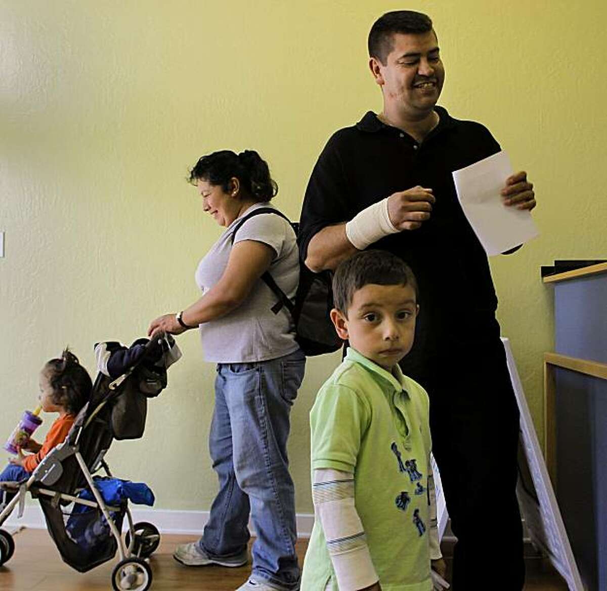 The Lopez family, Rosaure, 2, Aurelia, Sergio, 4, and Juan, who was in for a wrist injury, seeking medical attention at Clinic By The Bay, on Thursday Nov. 4, 2010 in San Francisco, Calif. The first clinic in the Bay Area and only the second in California that is staffed by retired and volunteer doctors and nurses.