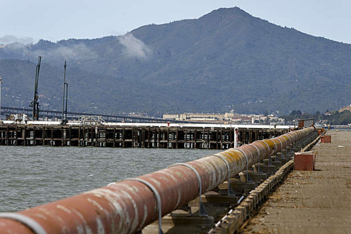 Rusty pipes extend out to the end of a pier at the old Point Molate Naval Supply Center in Richmond, Calif., on Tuesday, Aug. 11, 2009. The Guideville Band of Pomo Indians tribe may use the pier for commuter ferry service if their proposed resort and casino plan is approved.