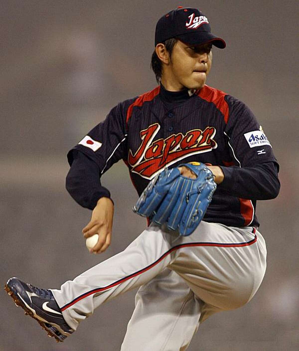 Japan starter Hisashi Iwakuma winds up to deliver a pitch during the sixth inning against Cuba during their World Baseball Classic game in San Diego Wednesday, March 18, 2009. (AP Photo/Denis Poroy)