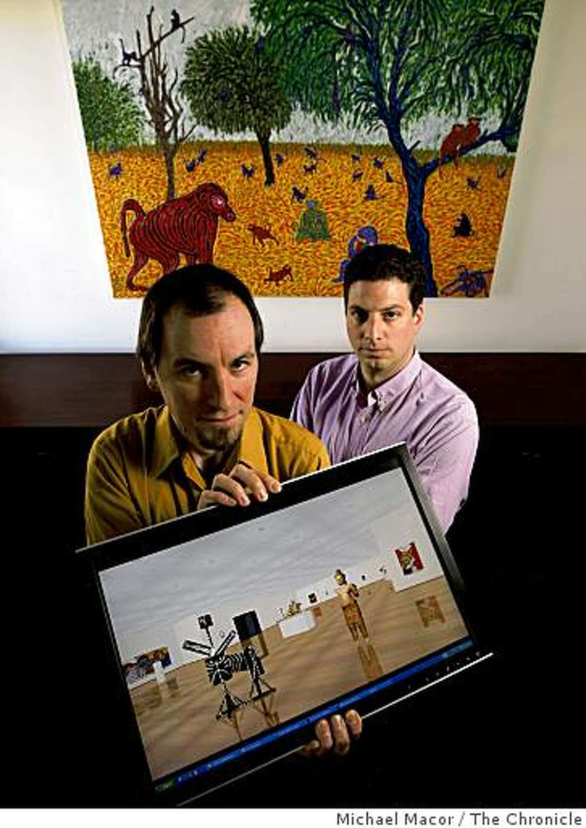 "Virtual Gallery", a company founded by, Jantje Boichel, (left) chief technology officer and Jordan Klineman, company president, with an on-screen sample of their product that uses 3-D virtual environments for art museums to plan exhibits. At their office in downtown San Francisco, Calif. on Wednesday Mar. 18, 2009.