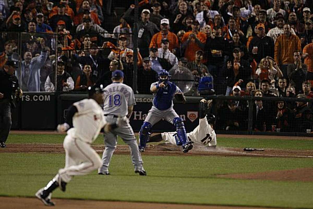 Cody Ross scores on a Juan Uribe single in the seventh. Uribe took second on the throw and was safe as the San Francisco Giants take on the Texas Rangers in Game 2 of the World Series at AT&T Park in San Francisco, Calif., on Thursday, October 28, 2010.