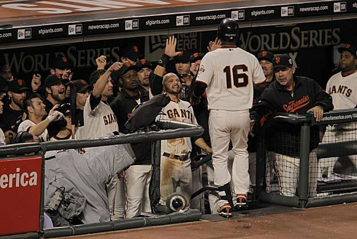 Giants Edgar Renteria is greeted by the dugout after his solo home run in the fifth inning as the San Francisco Giants take on the Texas Rangers in Game 2 of the World Series at AT&T Park in San Francisco, Calif., on Thursday, October 28, 2010.