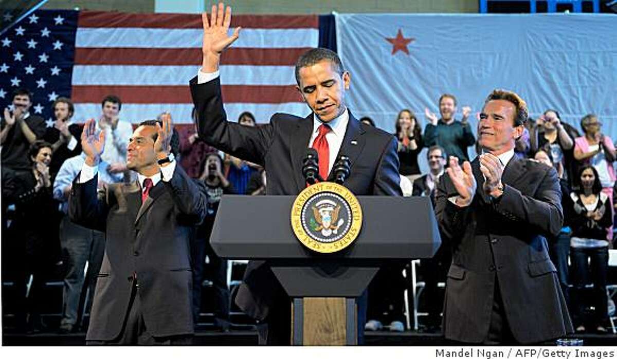 US President Barack Obama acknowledges applause as Los Angeles Mayor Antonio Villaraigosa (L) and California Governor Arnold Schwarzenegger (R) look on during a town hall meeting at the Miguel Contreras Learning Complex March 19, 2009 in Los Angeles. AFP PHOTO/Mandel NGAN (Photo credit should read MANDEL NGAN/AFP/Getty Images)